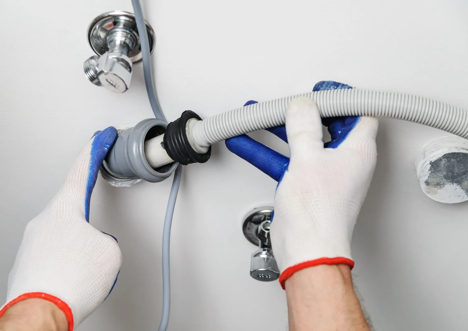 installing a dishwasher by connecting the drain line