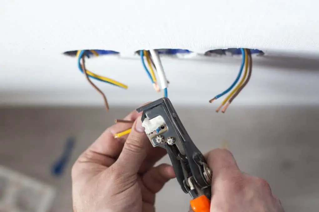 electrician installing doorbell wiring