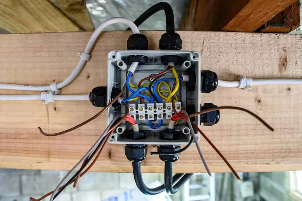 Exposed Wiring box half complete ready for operation in home garage; electrical safety tips
