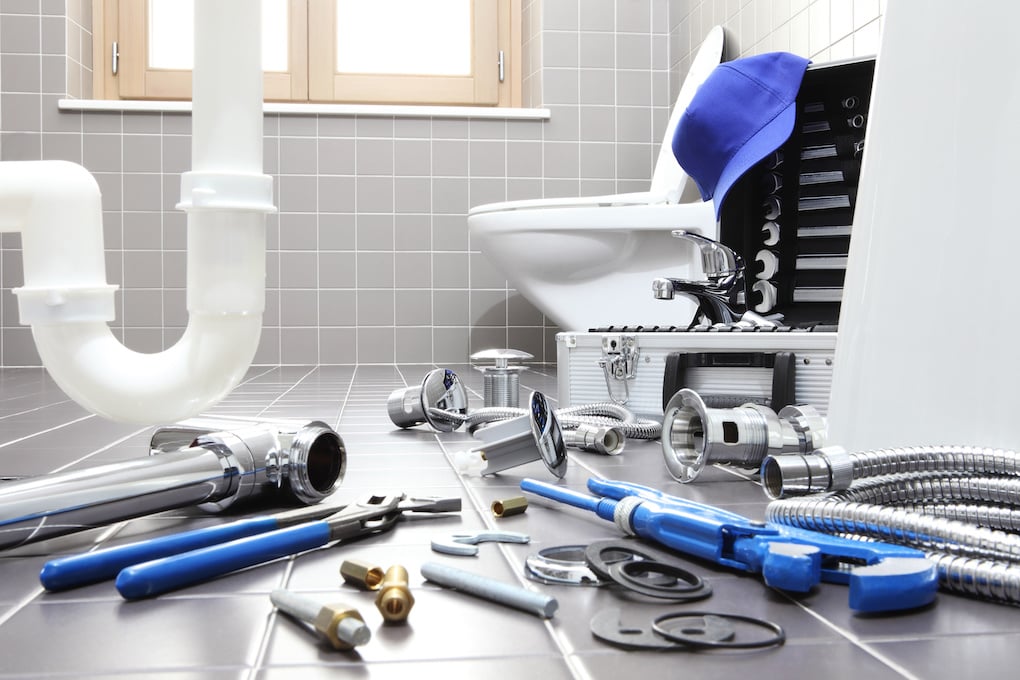 plumber tools and equipment in a bathroom