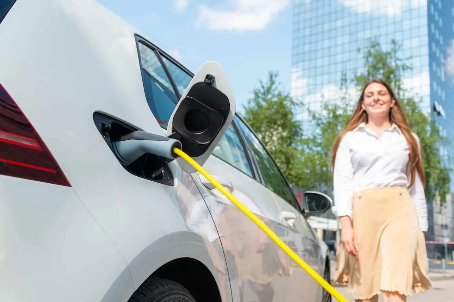 woman goes to unplug her ev charger