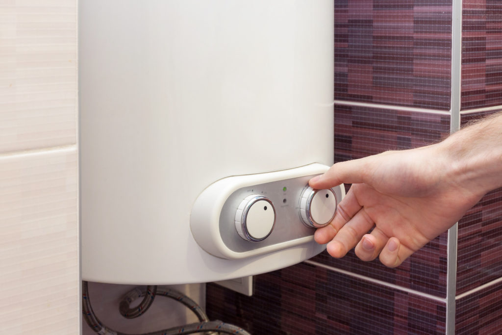 electric water heater installation hand