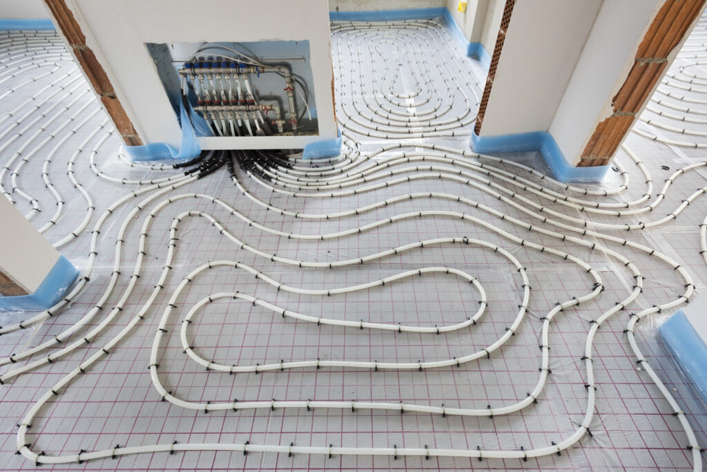 pipes of under floor heating in construction of new residential house