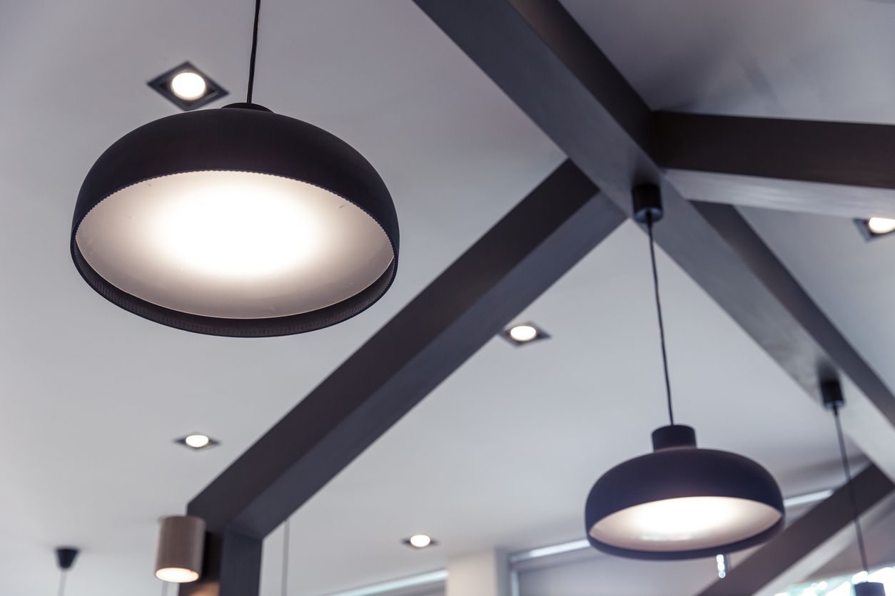 Modern black ceiling lamps emitting a soft light