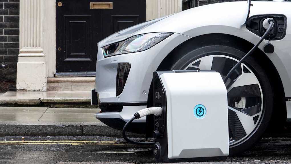 portable ev charger plugged into EV; apartments with ev charging