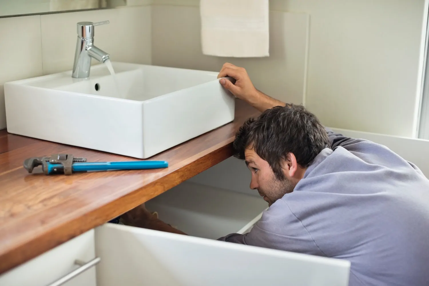 person installing a new sink