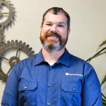 4Front Energy's Master Electrician Derek standing and smiling at the camera.