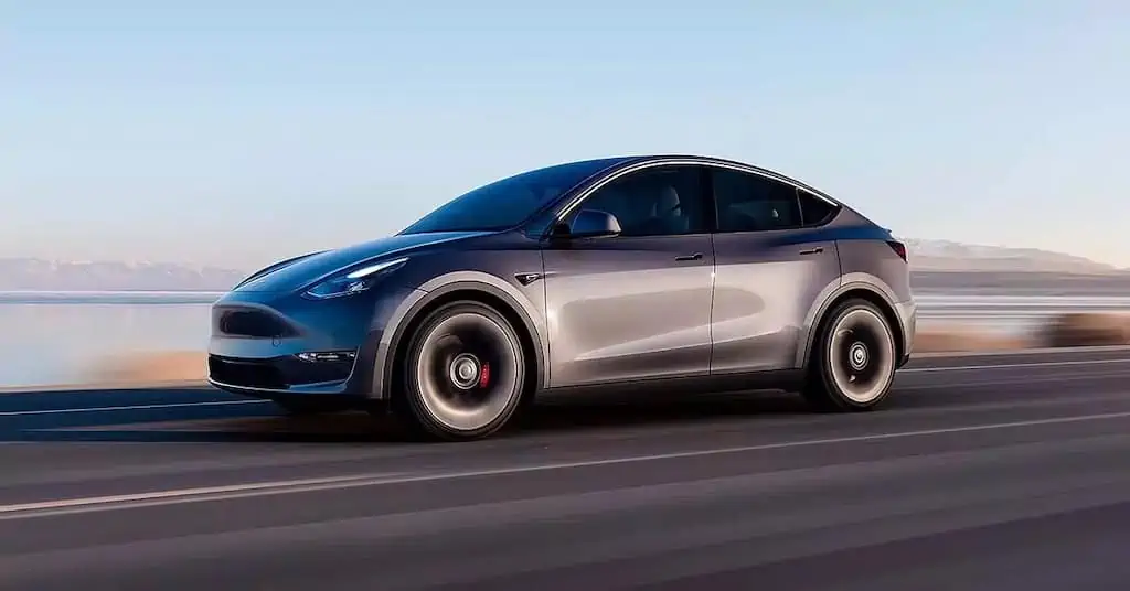 Gray Tesla model Y; extended range electric vehicles