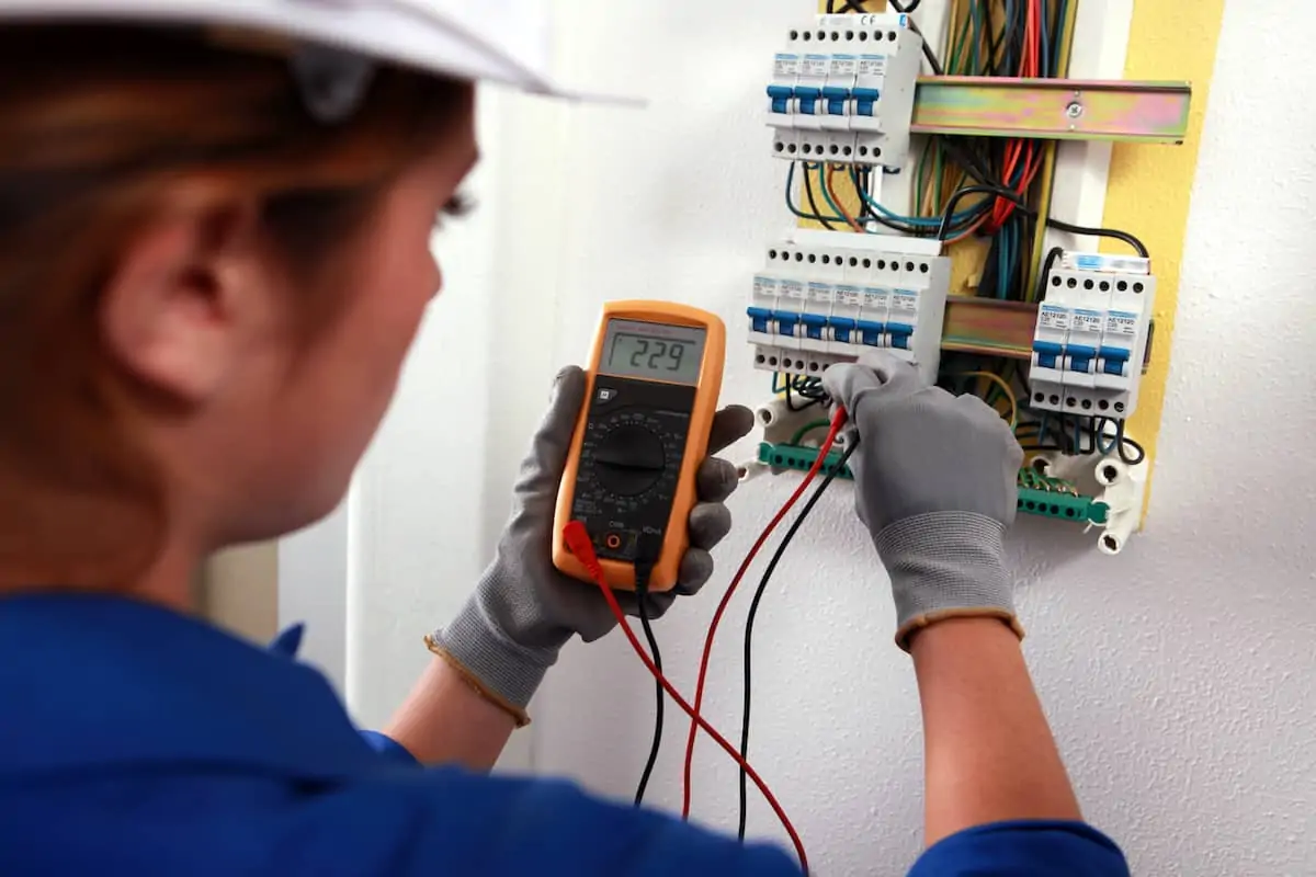 An electrician testing a home's wiring