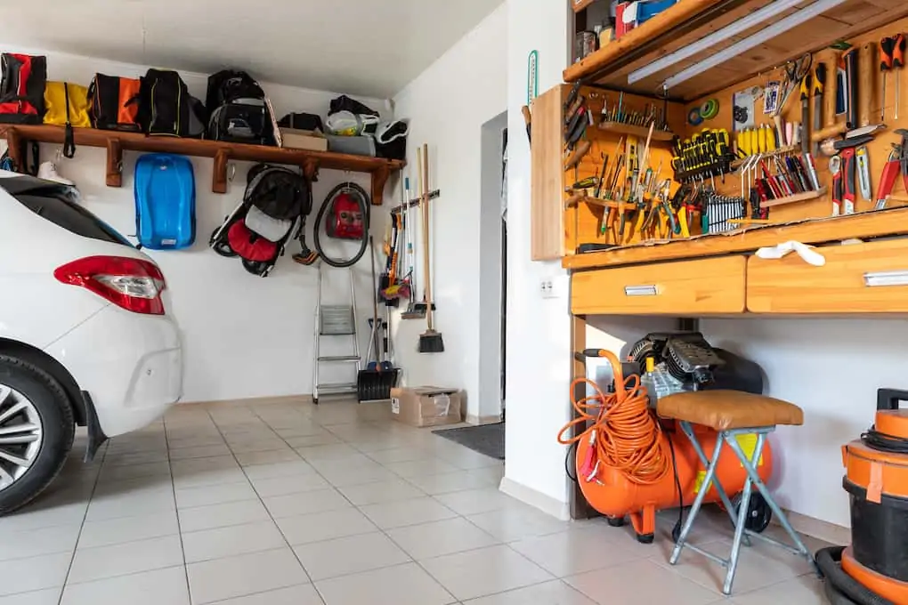 garage shot with view of workbench and car