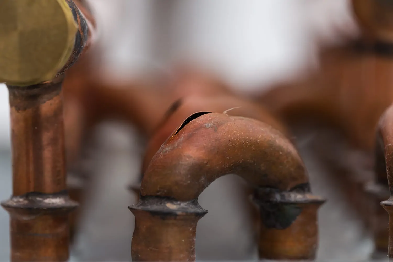 burst copper pipes from the cold, closeup