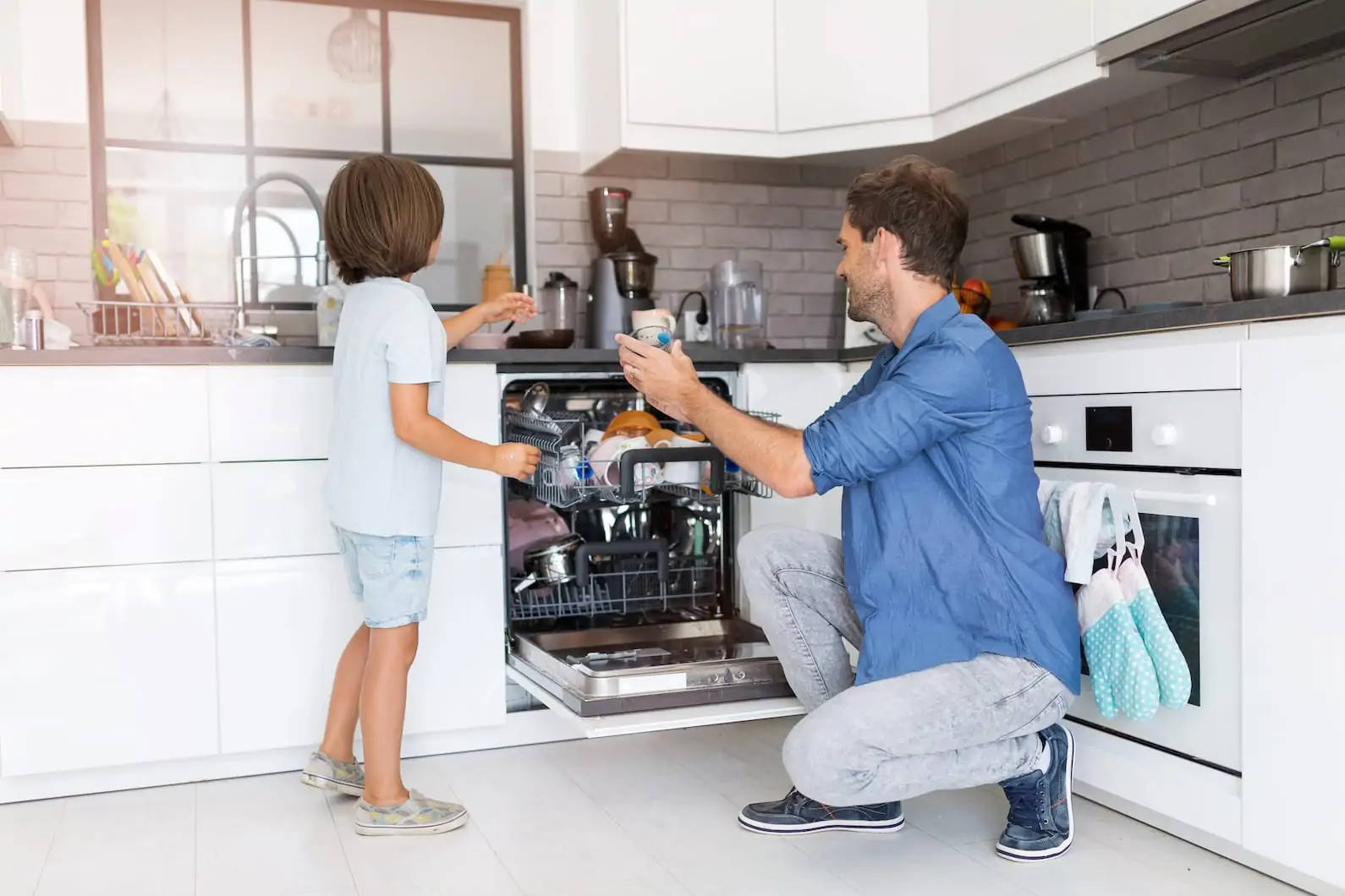 family loading dishwasher