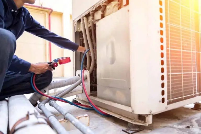 man fixing ac unit on roof; things that fail a home inspection