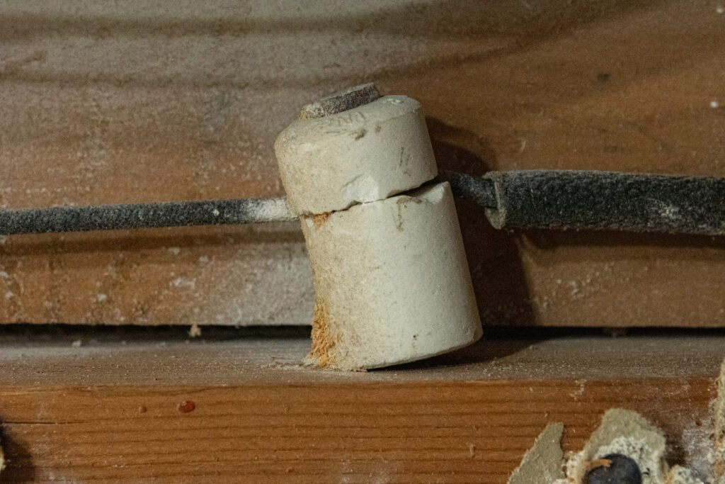 Close up of knob and tube wiring